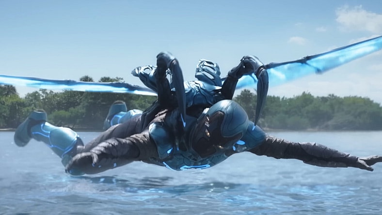Jamie Reyes (Xolo Maridueña) breaks his fall in Blue Beetle (2023), DC Studios