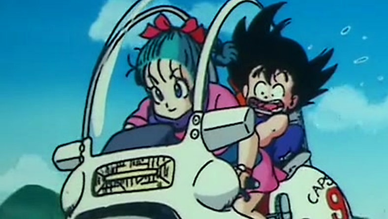 Bulma (Hiromi Tsuru) takes a young Goku (Masako Nozawa) for his first motorcycle ride in Dragon Ball Episode 1 "Bulma and Son Goku" (1986), Toei Co. Ltd.