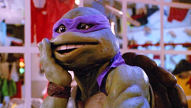 Donatello goes "Oops" after kicking a thug in Teenage Mutant Ninja Turtles II: The Secret of The Ooze (1991), New Line Cinema