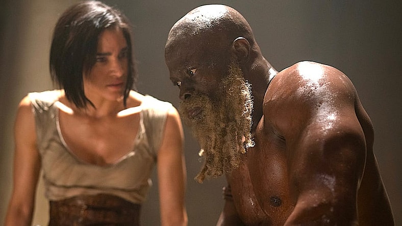 REBEL MOON: (L-R) Sofia Boutella as Kora and Djimon Hounsou as Titus in Rebel Moon. Cr. Clay Enos/Netflix © 2023