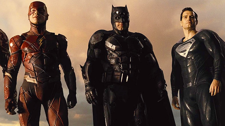The Flash (Ezra Miller), Batman (Ben Affleck) and Superman (Henry Cavill) stand triumphant over Darkseid (Ray Porter) in Zack Snyder's Justice League (2021), Warner Bros. Pictures