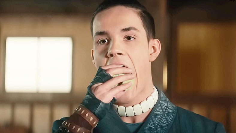 Sokka (Ian Ousley) grabs a bite to eat in Avatar: The Last Airbender (2024), Netflix
