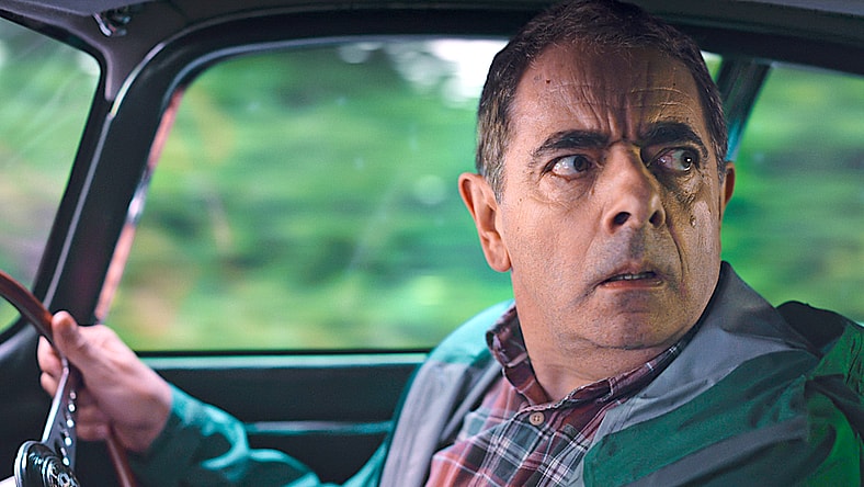 A desperate Trevor Bingley (Rowan Atkinson) rushes to the veterinary in Man vs. Bee Season 1 Episode 8 "Chapter 8" (2022), Netflix