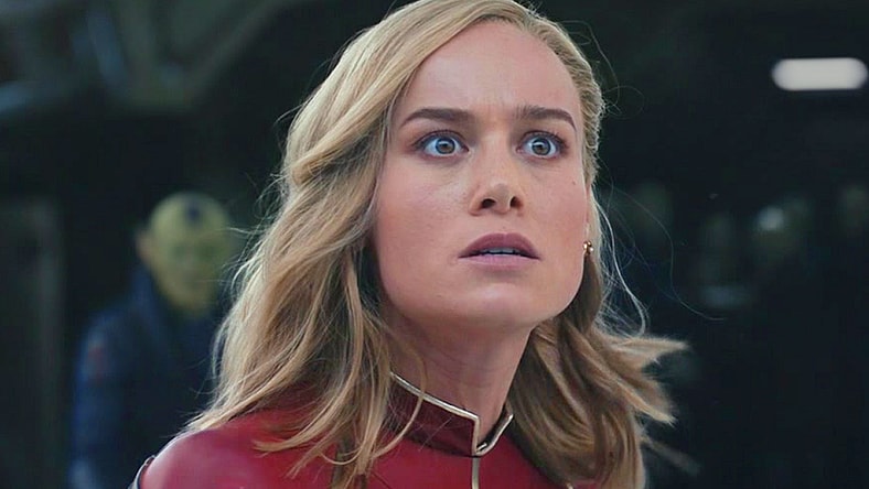 Captain Marvel (Brie Larson) watches on in horror as the Kree invade Tarnax in The Marvels (2023), Marvel Entertainment