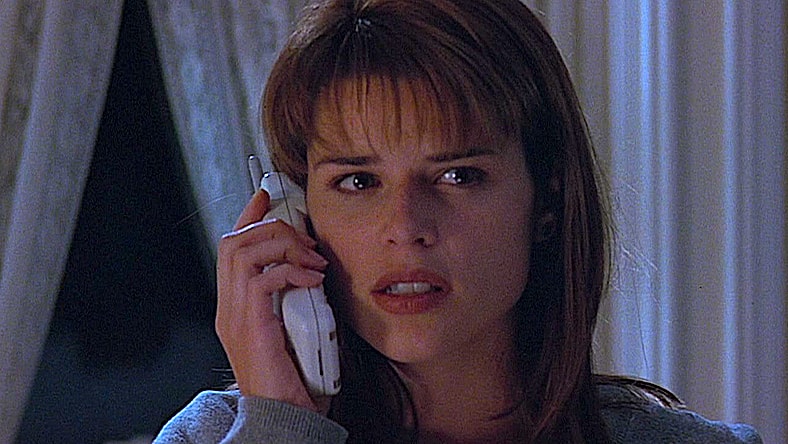 Sidney Prescott (Neve Campbell) has her first interaction with Ghostface in Scream (1996), Paramount Pictures