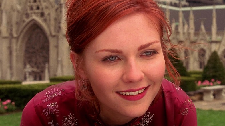 Mary-Jane Watson (Kirsten Dunst) watches as her new hero (Tobey Maguire) swings off into the sunset in Spider-Man (2002), Sony