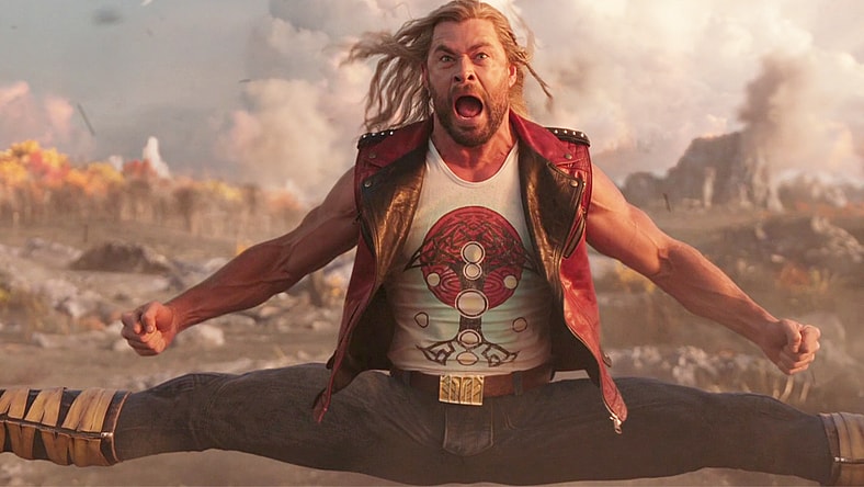 Thor (Chris Hemsworth) split kicks a pair of Booskan speeders in Thor: Love and Thunder (2022), Marvel Entertainment