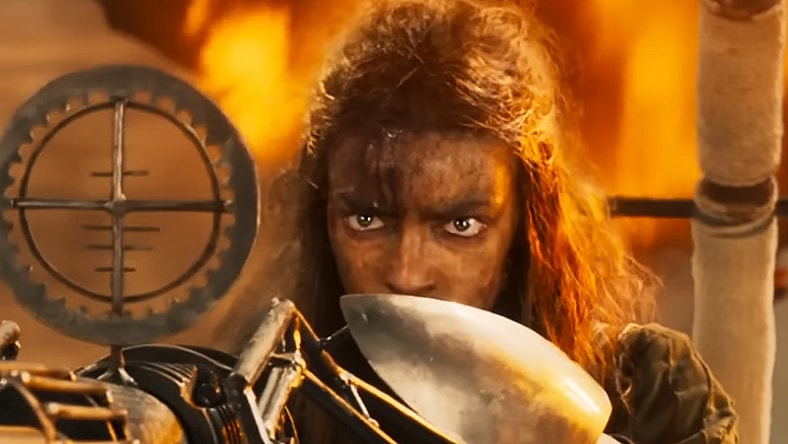 Furiosa (Anya Taylor-Joy) takes aim with a harpoon gun in Furiosa: A Mad Max Saga (2024), Warner Bros. Pictures
