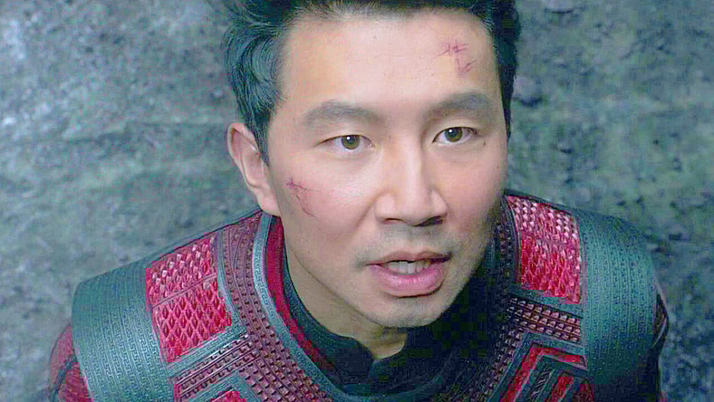 Shang-Chi (Simu Liu) watches on as the Dweller-in-Darkness emerges from its prison in Shang-Chi and the Legend of the Ten Rings (2021), Marvel Entertainment