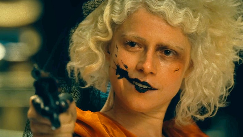 The Bride (Jessie Buckley) commits a stick-up in The Bride! (2026), Warner Bros. Pictures