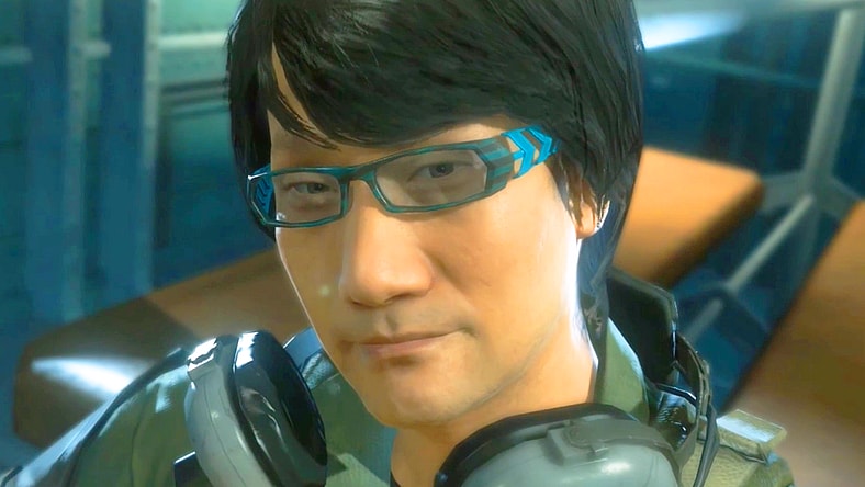 A familiar face (Hideo Kojima) thanks Naked Snake (Kiefer Sutherland) for a quick rescue in Metal Gear Solid V: The Phantom Pain (2015), Kojima Productions