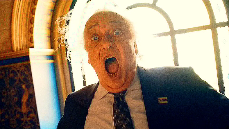 Boravian Prime Minister Vasil Ghurkos (Zlatko Burić) recoils in fear as Hawkgirl (Isabela Merced) closes in on him in Superman (2025), DC Studios