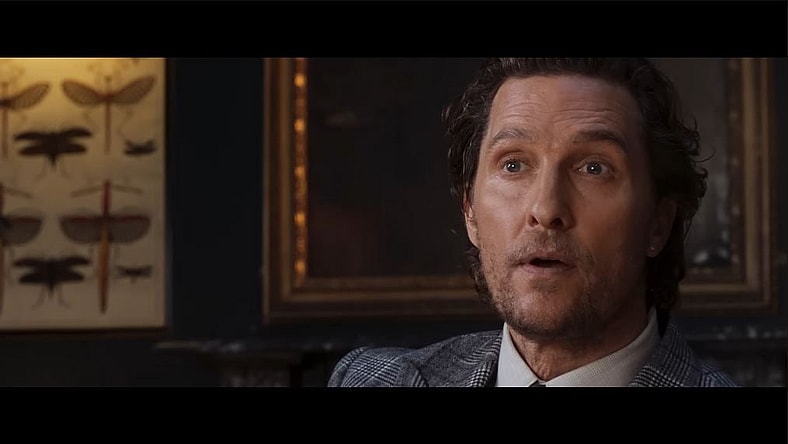 Mickey Pearson (Matthew McConaughey) in a standoff at the club in The Gentlemen (2019), Miramax