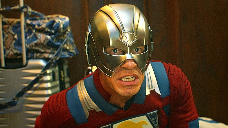 The Earth-2 Peacemaker (John Cena) prepares to launch a pair of helmet-fired ninja stars in Peacemaker Season 2 Episode 1 "The Ties That Grind" (2025), DC Studios