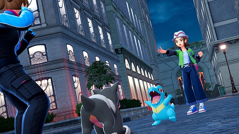 The player and their Totodile fight an opposing trainer's Houndour in Pokémon Legends: Z-A (2025), Nintendo