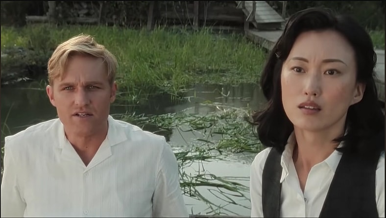 Lee (Wyatt Russell) and Keiko (Mari Yamamoto) are shocked and oddly relieved they couldn't kill Godzilla in Monarch: Legacy of Monsters Season 1 Episode 6 "Terrifying Miracles" (2023), Apple TV+