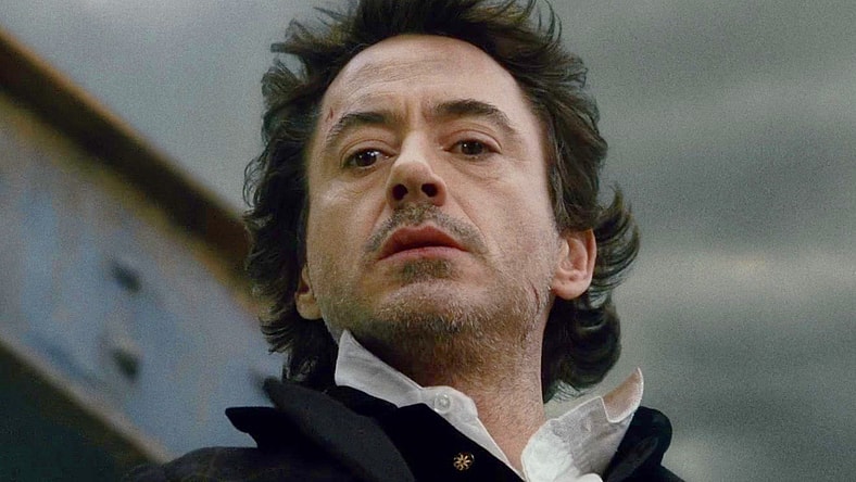 Holmes (Robert Downey Jr.) watches on as Lord Blackwood (Mark Strong) chokes on the skeleton of the Tower Bridge in Sherlock Holmes (2009), Warner Bros. Pictures