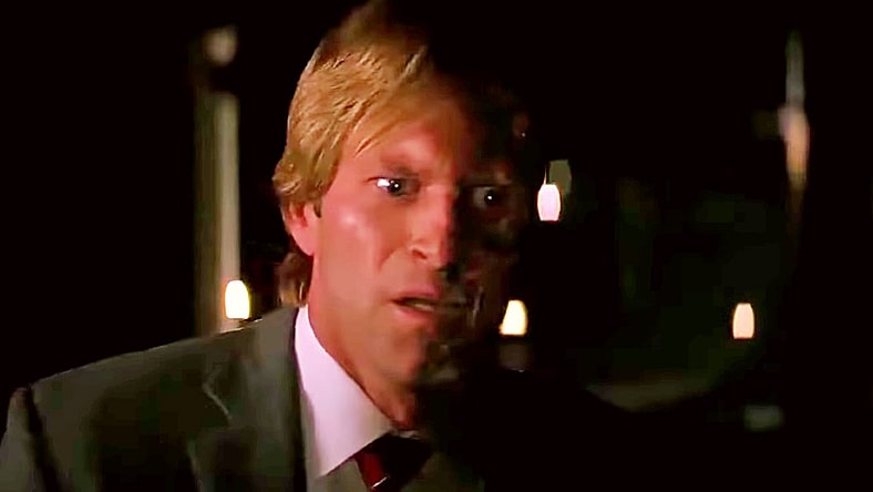 Harvey Dent (Aaron Eckhart) isn't expecting to escape fate in The Dark Knight (2008), Warner Bros. Pictures