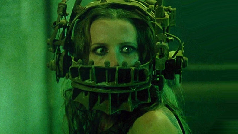 Amanda (Shawnee Smith) finds herself subjected to Jigsaw's (Tobin Bell) reverse bear trap in Saw (2004), Lionsgate Films