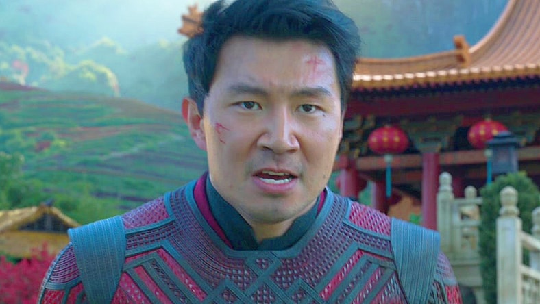 Shang-Chi (Simu Liu) stands in defense of Tao Lo against Wenwu (Tony Leung) in Shang-Chi and the Legend of the Ten Rings (2021), Marvel Entertainment
