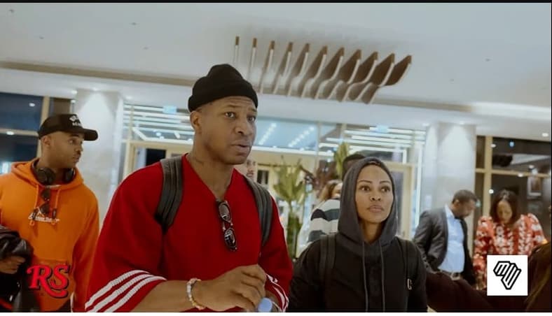 Jonathan Majors and Meagan Good at a cultural event in Conakry, Guinea, to receive their citizenship in January 2026, Rolling Stone Africa via YouTube