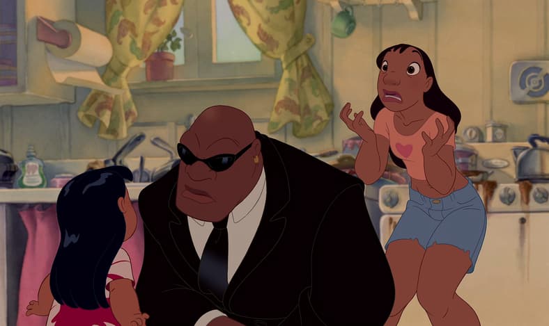 Nani (Tia Carrere) attempts to guide Lilo (Daveigh Chase) through her interview with Cobra Bubbles (Ving Rhames) in Lilo & Stitch (2002), Walt Disney Studios