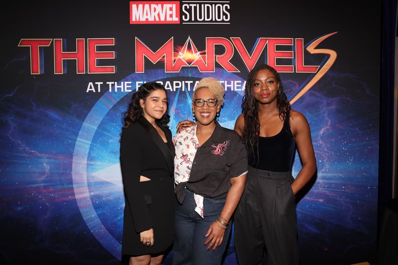 LOS ANGELES, CALIFORNIA - NOVEMBER 09: (L-R) Iman Vellani, Angelique Roche and Nia DaCosta attend THE MARVELS Fan Screening Surprise Talent Appearance at El Capitan Theatre in Hollywood, California on November 09, 2023. (Photo by Jesse Grant/Getty Images for Disney)