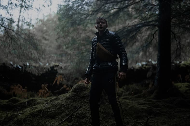 Maxwell Jenkins as Thomas in the action horror film Arcadian. Image property of RLJE Films.