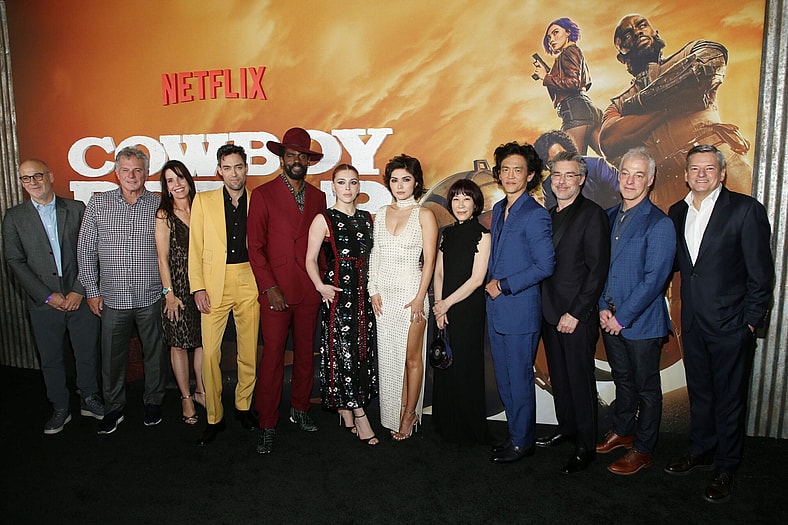 LOS ANGELES, CALIFORNIA - NOVEMBER 11: (L-R) Netflix VP of Scripted Series Peter Friedlander, Marty Adelstein, Becky Clements, Alex Hassell, Mustafa Shakir, Elena Satine, Daniella Pineda, Yoko Kanno, John Cho, André Nemec, Jeff Pinkner, and Netflix Co-CEO and CCO Ted Sarandos attend Netflix's Jazzy Cowboy Bebop Premiere in Los Angeles at Goya Studios on November 11, 2021 in Los Angeles, California. (Photo by Phillip Faraone/Getty Images for Netflix)