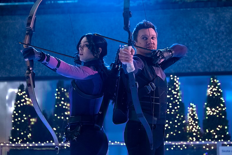 Hailee Steinfeld as Kate Bishop and Jeremy Renner as Clint Barton/Hawkeye in Marvel Studios' HAWKEYE. Photo by Chuck Zlotnick. © Marvel Studios 2021. All Rights Reserved.