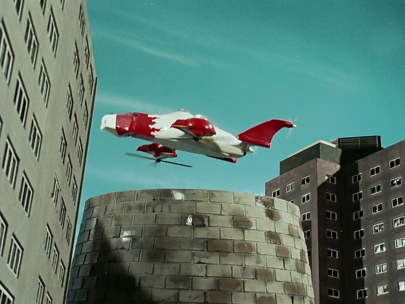 Aorenger (Hiorshi Miyauchi) launches Variblune from EAGLE headquarters in Himitsu Sentai Gorenger Episode 1 "The Crimson Sun! The Invincible Gorengers" (1975), Toei Co. Ltd.