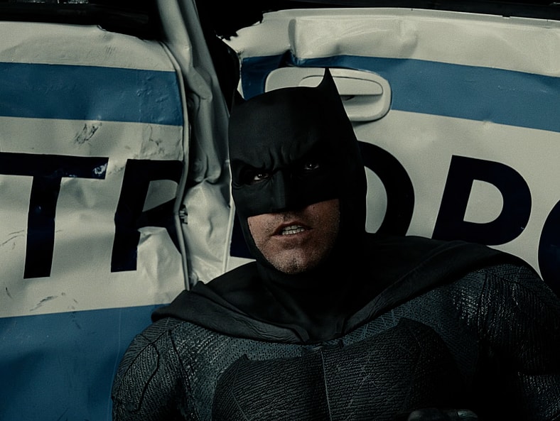 Batman (Ben Affleck) is overwhelmed by the power of Kal-El (Henry Cavill) in Zack Snyder's Justice League (2021), Warner Bros. Pictures