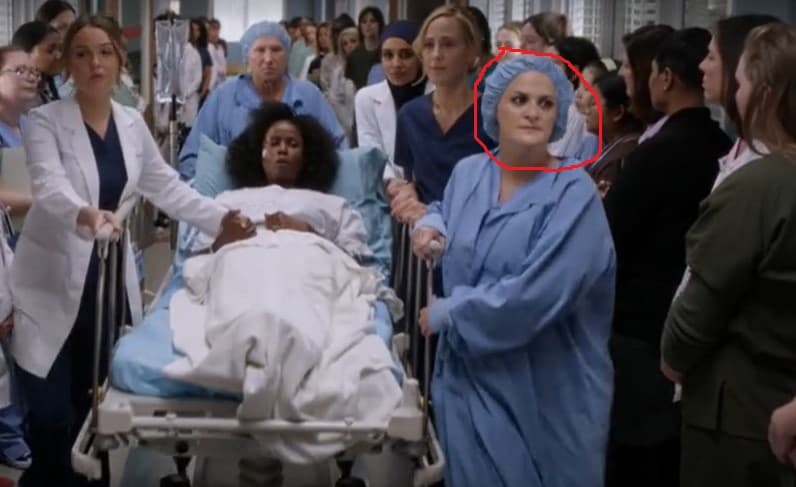 Elisabeth Finch as Nurse Elisabeth in the women-only parade scene taking  Abby (Khalilah Joi) to the operating room in Grey's Anatomy (S15E19) Silent All These Years: Shondaland 2019