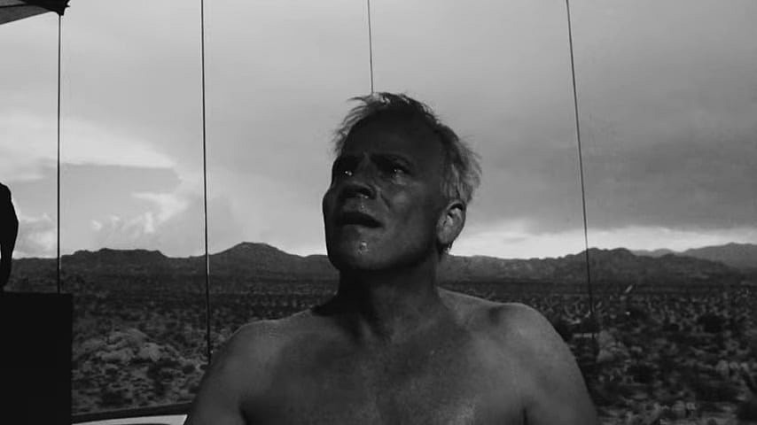 Jaxxon Pierce (Stephen Dorff) attempts to reason with his captors in Divinity (2023), Divinity the Film