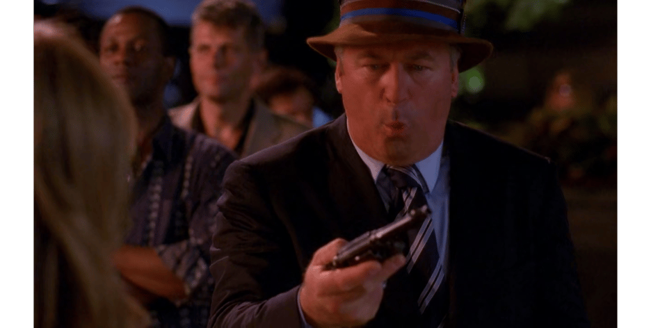 Jack Donaghy (Alec Baldwin) is surprised to find himself in possession of a gun in 30 Rock Season 3 Episode 3 "The One with the Cast of Night Court" (2008), NBC