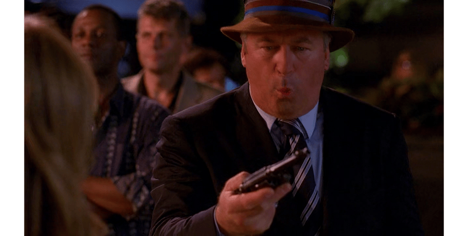 Jack Donaghy (Alec Baldwin) is surprised to find himself in possession of a gun in 30 Rock Season 3 Episode 3 "The One with the Cast of Night Court" (2008), NBC