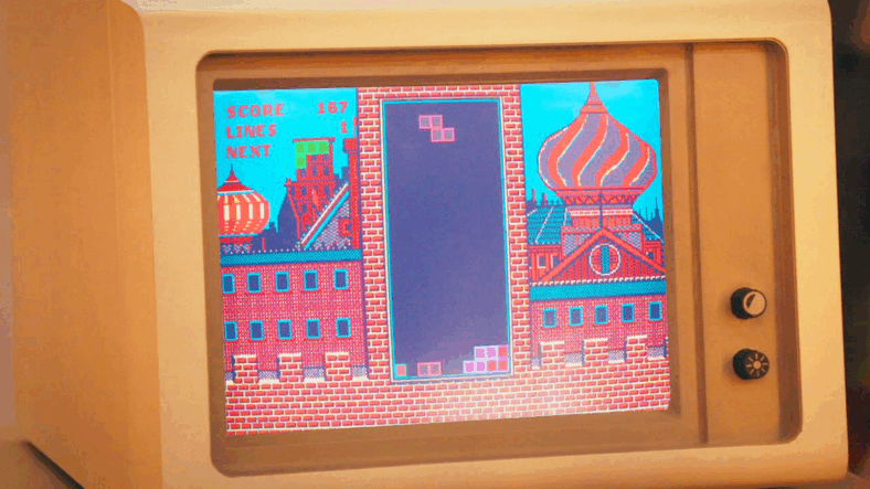 Henk Rogers (Taron Egerton) drops his first tetromino in Tetris (2023), Apple