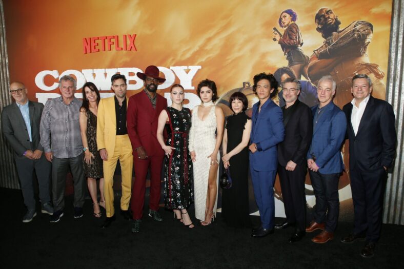 LOS ANGELES, CALIFORNIA - NOVEMBER 11: (L-R) Netflix VP of Scripted Series Peter Friedlander, Marty Adelstein, Becky Clements, Alex Hassell, Mustafa Shakir, Elena Satine, Daniella Pineda, Yoko Kanno, John Cho, André Nemec, Jeff Pinkner, and Netflix Co-CEO and CCO Ted Sarandos attend Netflix's Jazzy Cowboy Bebop Premiere in Los Angeles at Goya Studios on November 11, 2021 in Los Angeles, California. (Photo by Phillip Faraone/Getty Images for Netflix)