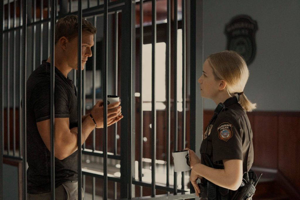 Pictured (L-R): Alan Ritchson as Jack Reacher and Willa Fitzgerald as Roscoe Conklin in Reacher