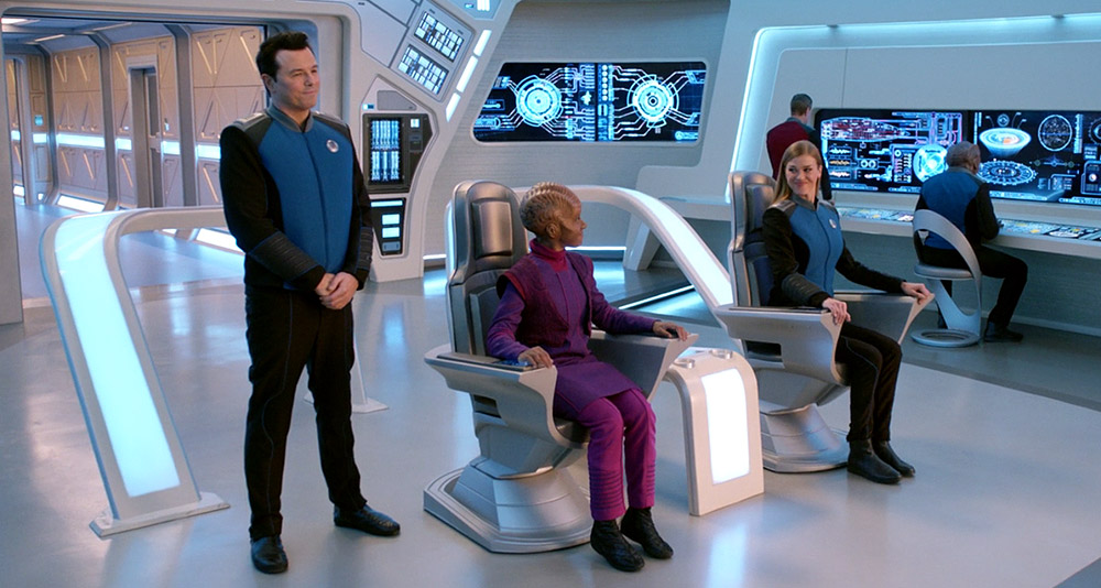 Topa sits in the captain's chair in The Orville: New Horizons
