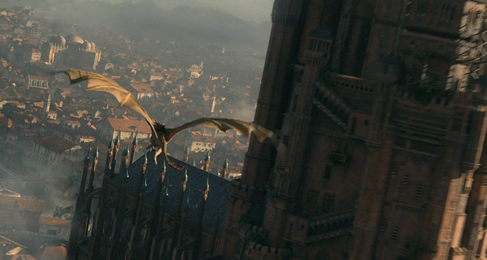 A dragon soaring through King's Landing in House of the Dragon