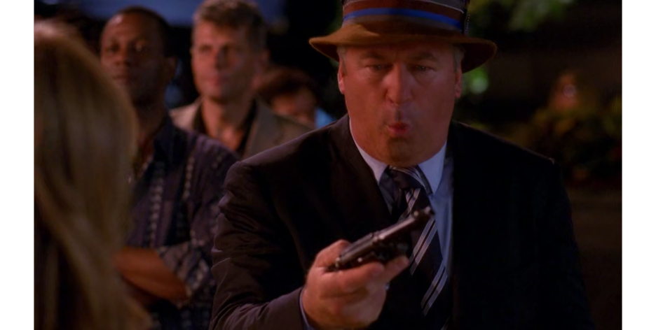 Jack Donaghy (Alec Baldwin) is surprised to find himself in possession of a gun in 30 Rock Season 3 Episode 3 "The One with the Cast of Night Court" (2008), NBC