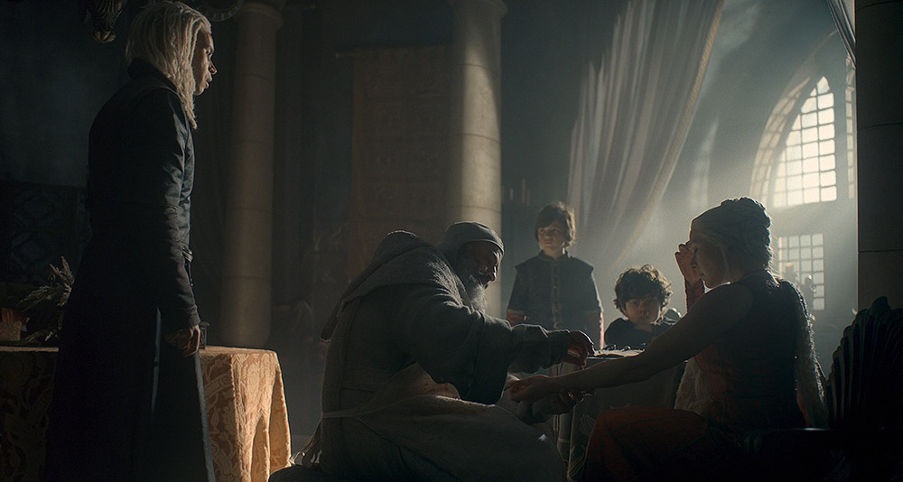 A physician attends to Rhaenyra's wound in House of the Dragon, HBO
