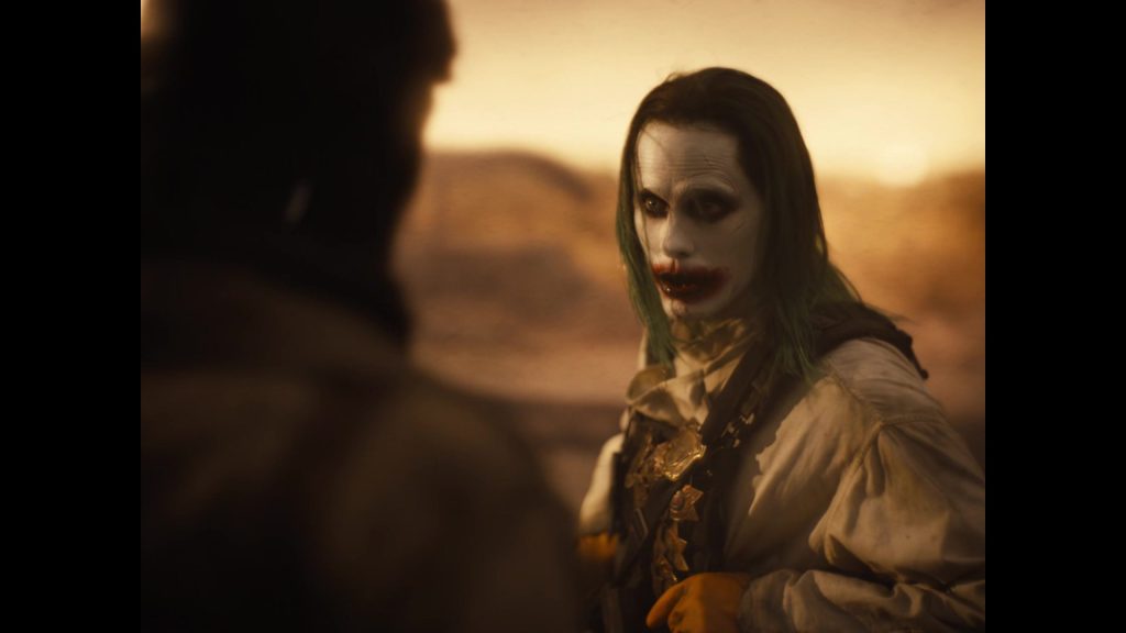 Joker (Jared Leto) gives a warning to Batman (Ben Affleck) in Zack Snyder’s Justice League (2021), Warner Bros. Pictures