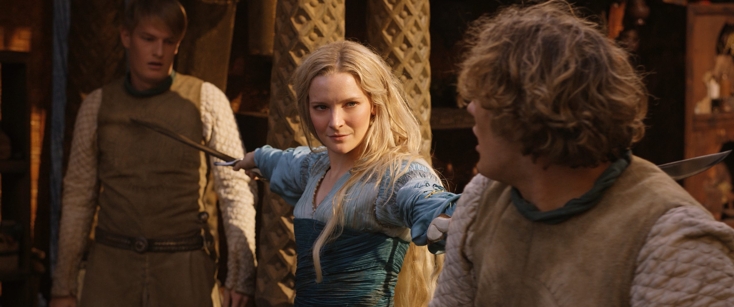 Galadriel (Morfydd Clark) draws her blades against two upstart warriors in The Lord of the Rings: The Rings of Power Season 1 Episode 5 "Parting" (2022), Amazon Studios