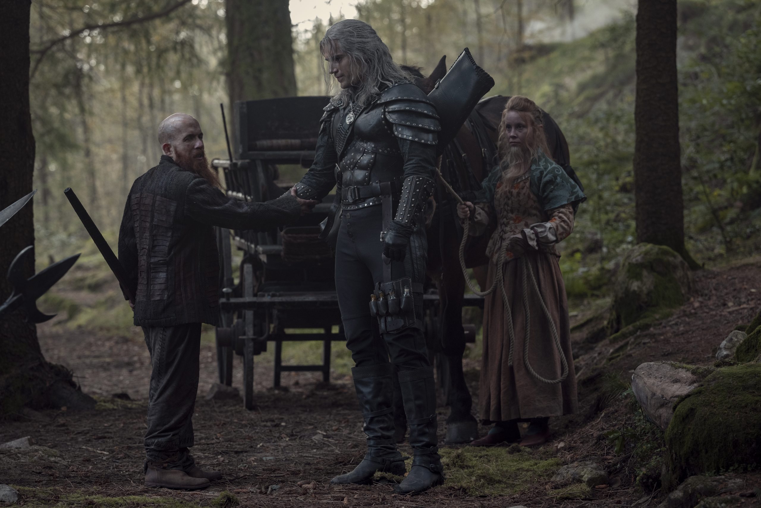 Geralt (Henry Cavill) bids farewell to Yarpen Zigrin (Jeremy Crawford) in The Witcher Season 2 Episode 7 “Voleth Meir” (2021) via Netflix