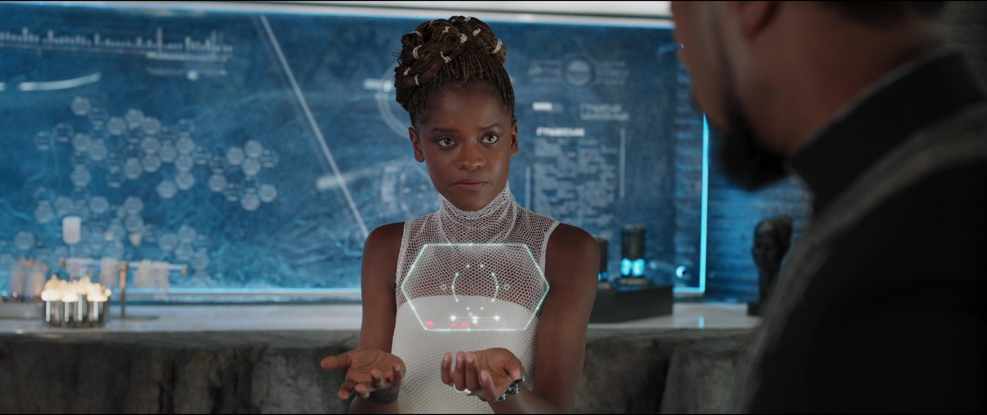 Shuri (Letitia Wright) speaks with T'Challa (Chadwick Boseman) in Black Panther (2019)
