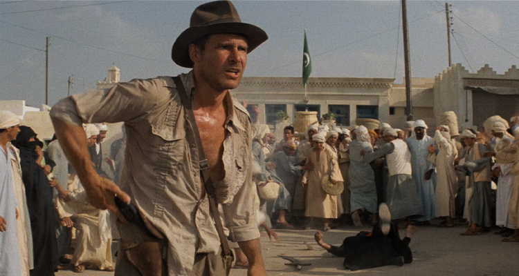 Indiana Jones (Harrison Ford) has no time for fancy sword play.