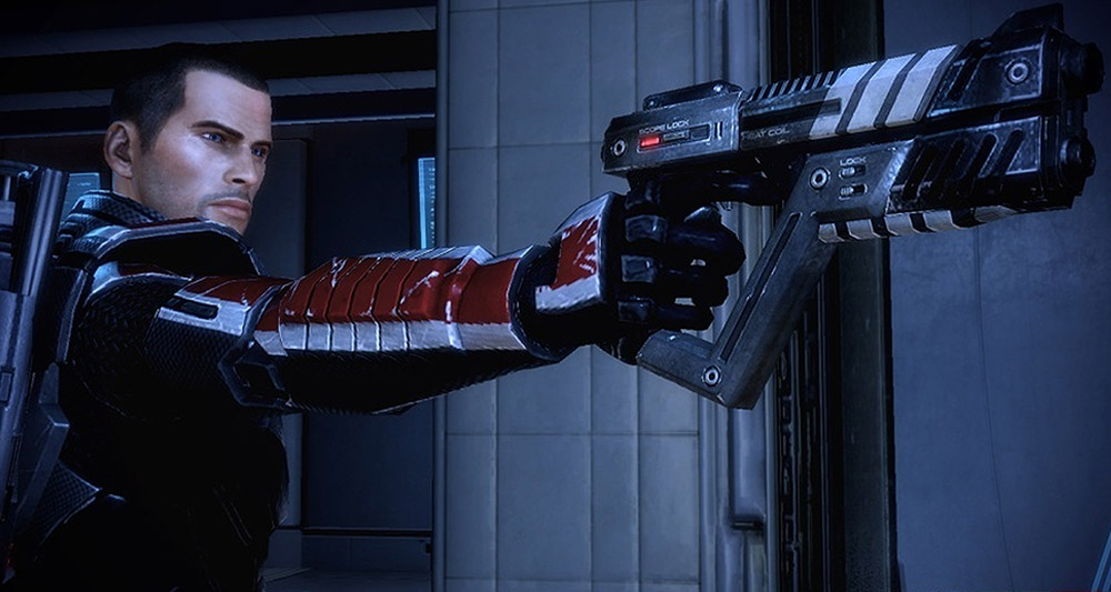 Commander Shepard pointing a gun in 'Mass Effect 2,' BioWare