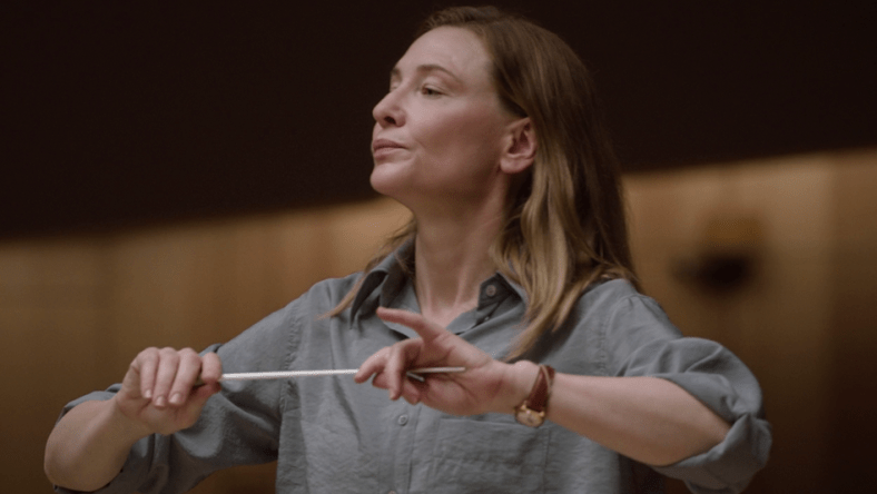 Lydia Tár (Cate Blanchett) readies herself to conduct via Tár (2022), Universal Pictures